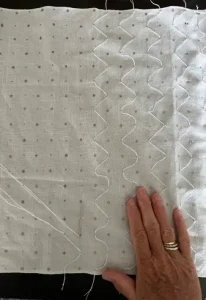 Close up of artist stitching - Indigo